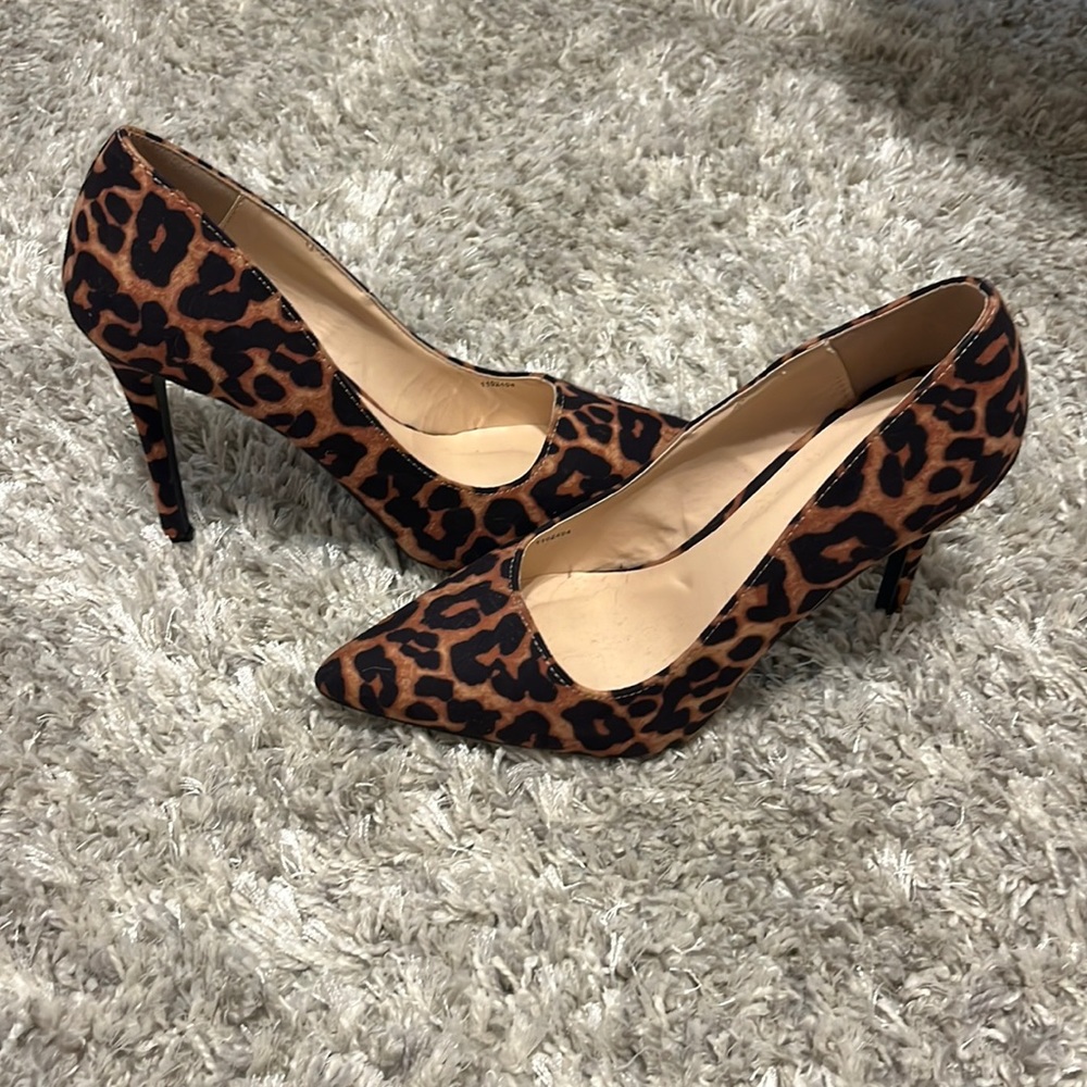 8” leopard print faux suede heels.
